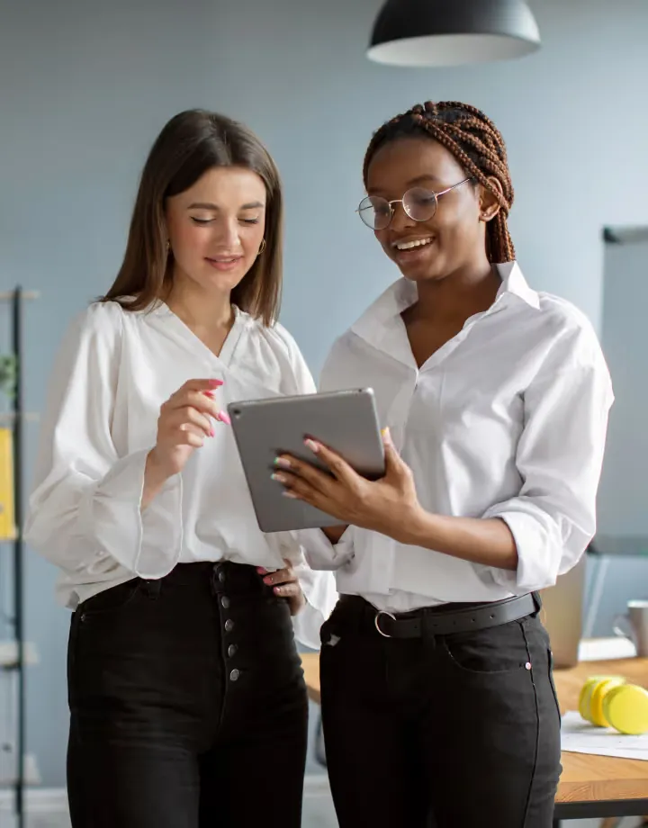 Two colleagues looking at a tablet together